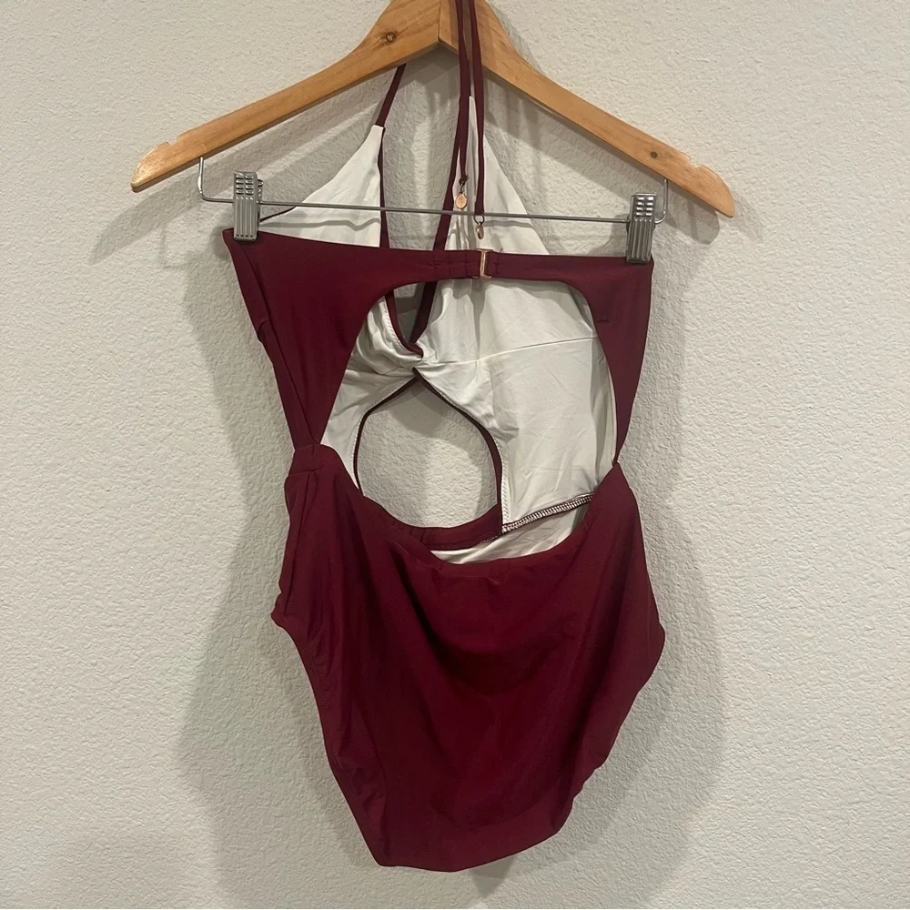 6 Shore Road maroon one piece with cut out and tie neck size medium